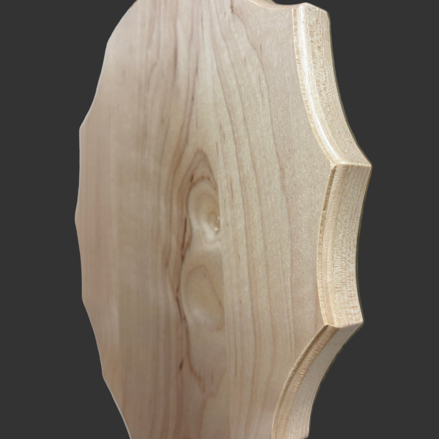 Wooden decorative piece on a wooden surface